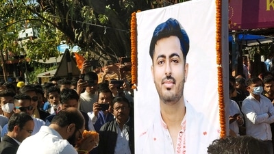 All Assam Students Union (AASU) chief Adviser Samujjal Kumar Bhattacharya pays floral tribute to the party leader Animesh Bhuyan, in Jorhat, Assam. (ANI Photo)