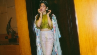 The long sleeves coat gave a spring vibe to winter fashion and Radhika completed her attire with a pair of white heels. (Instagram/rashmika_mandanna) The long sleeves coat gave a spring vibe to winter fashion and Radhika completed her attire with a pair of white heels. (Instagram/rashmika_mandanna)