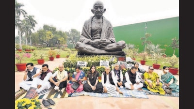 Suspended Opposition Rajya Sabha MPs protest near Gandhi statue during the winter session of Parliament, in New Delhi, on Wednesday. (Arvind Yadav/HT photo) Suspended Opposition Rajya Sabha MPs protest near Gandhi statue during the winter session of Parliament, in New Delhi, on Wednesday. (Arvind Yadav/HT photo)