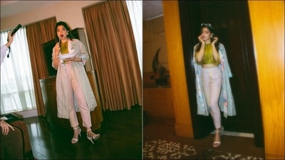 The pictures from her latest photoshoot have currently set the Internet on fire and feature the diva acing the layering game as she teamed an olive green crop top and a pair of high-waist striped pants with a floral print coat. (Instagram/rashmika_mandanna)