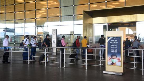 Security staff check the details of passengers before entering the terminal for departure at the Chhatrapati Shivaji Maharaj International Airport on Wednesday (Vijay Bate)