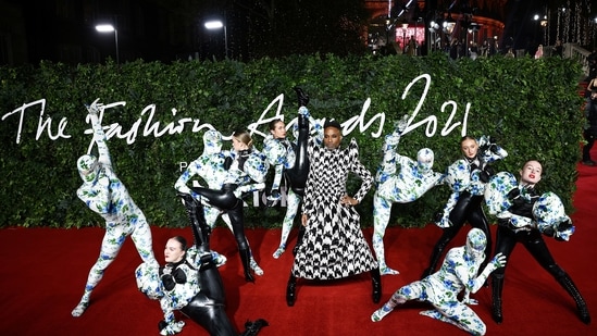Billy Porter strikes a bold pose for the paparazzi in his monochrome outfit at the Fashion Awards 2021 in London.(REUTERS)