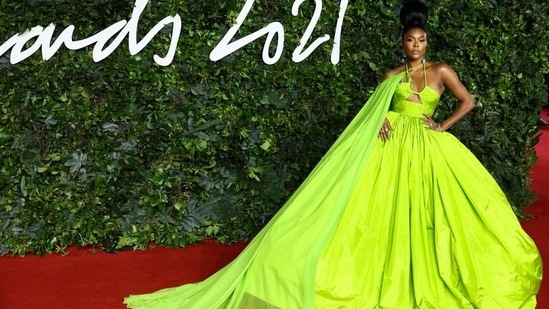 Gabrielle Union stuns in lime green caped gown as she poses on the red carpet at the Fashion Awards 2021 in London, Britain.(REUTERS)