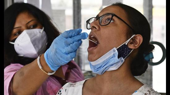 According to the health department, separate testing camps have been set up for international travellers outside the Civil Hospital and several private hospitals across the district. (HT Archive)