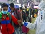 A healthcare worker checks the oxygen level of passengers arriving from other states, at Chhatrapati Shivaji Terminus in Mumbai on Thursday.(ANI Photo) A healthcare worker checks the oxygen level of passengers arriving from other states, at Chhatrapati Shivaji Terminus in Mumbai on Thursday.(ANI Photo)