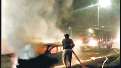The driver had a narrow escape after a car caught fire in Sector 40, Chandigarh, on Thursday. (HT Photo)
