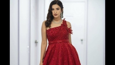 The ensemble is credited to Indian fashion label Rachit Khanna Turquoise and the red silk gown originally costs  <span class='webrupee'>₹</span>1,98,000 on their designer website. (Instagram/gauaharkhan)