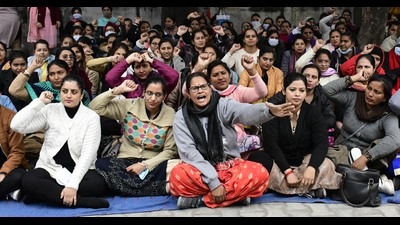 NHM employees protesting at the Civil Surgeon’s Office in Ludhiana on Thursday. (Gurpreet Singh/HT)