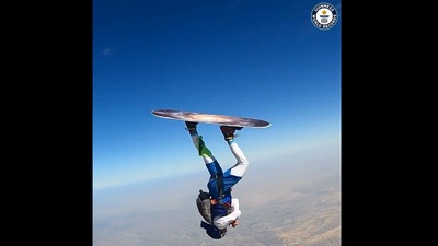 The image shows the man doing helicopter spins while skysurfing. (Instagram/@guinnessworldrecords)
