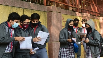 Students outside a school in New Delhi after schools in the national capital opened on November 29. (PTI) Students outside a school in New Delhi after schools in the national capital opened on November 29. (PTI)