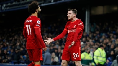 Liverpool's Mohamed Salah celebrates scoring their third goal with Andrew Robertson (REUTERS)