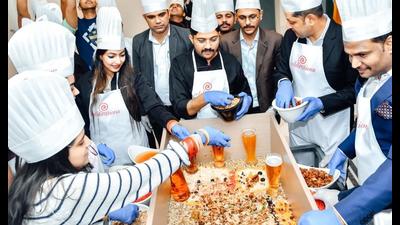 A cake mixing ceremony underway in Lucknow (HT Photo)