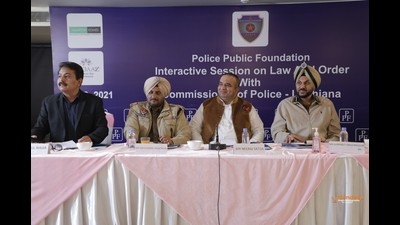Police commissioner Gurpreet Bhullar (extreme right) and industrialist Neeraj Satija (second from right) interacting with participants during a meeting organised by the Police Public Foundation at a hotel on Pakhowal Road in Ludhiana on Thursday. (HT Photo)