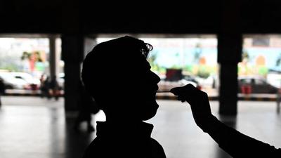 According to the state government’s daily health bulletin, 307 people in the city are battling the infection, down from a record high of nearly 100,000 on April 28. (AFP)