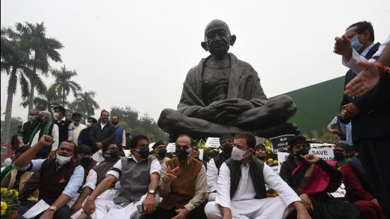 Opposition leaders including Congress MP Rahul Gandhi protested near the Mahatma Gandhi statue demanding the government revoke the suspension of 12 Rajya Sabha members at Parliament in New Delhi. (HT Photo/Arvind Yadav)