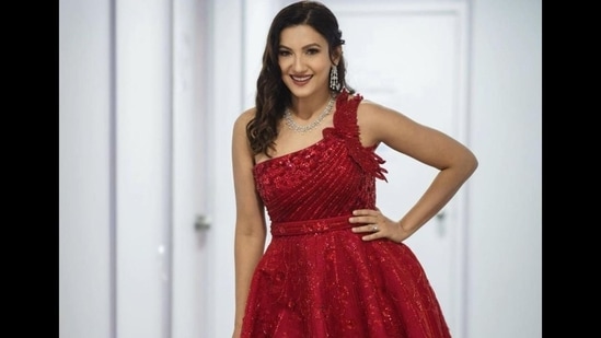 Gauahar Khan shows how to rock an elegant aesthetic along with a sensuous silhouette in a red one-shoulder gown as she dolls up to host a wedding in Delhi and we are taking fashion inspiration from her smoking hot look to slay on our next sultry outing.&nbsp;(Instagram/gauaharkhan)