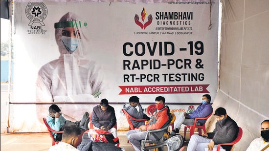 Passengers wait for their turn for a Covid-19 test at Lucknow airport, on Thursday, as the Uttar Pradesh government stepped up measures in view of the Omicron variant threat. (Deepak Gupta/HT photo) Passengers wait for their turn for a Covid-19 test at Lucknow airport, on Thursday, as the Uttar Pradesh government stepped up measures in view of the Omicron variant threat. (Deepak Gupta/HT photo)
