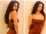 Disha Pata recently took to her Instagram handle to share a few stills of herself looking drop-dead-gorgeous in a strappy rustic brown short bodycon dress.(Instagram/@dishapatani)