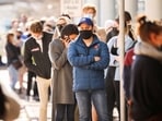 People queue outside a coronavirus disease (Covid-19) vaccination centre in Cape Town, South Africa.&nbsp;