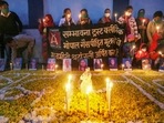 Members of Sambhavana Trust Clinic, which provides medical assistance to gas affected people, light candles to pay tribute to the victims of the 1984 gas tragedy on its 37th anniversary, in front of an abandoned Union Carbide plant, in Bhopal.(PTI) Members of Sambhavana Trust Clinic, which provides medical assistance to gas affected people, light candles to pay tribute to the victims of the 1984 gas tragedy on its 37th anniversary, in front of an abandoned Union Carbide plant, in Bhopal.(PTI)