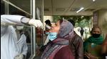 A health worker collects a swab sample of a woman for Covid-19 test at District Hospital in Noida’s Sector 30 on Friday. (Sunil Ghosh/HT photo) A health worker collects a swab sample of a woman for Covid-19 test at District Hospital in Noida’s Sector 30 on Friday. (Sunil Ghosh/HT photo)