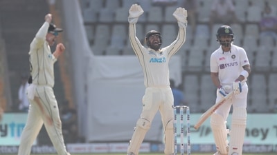New Zealand players appeals for the dismissal of India's captain Virat Kohli, right, during the day one of second test cricket match against India in Mumbai, India, Friday, Dec. 3, 2021.(AP Photo/Rafiq Maqbool) (AP)