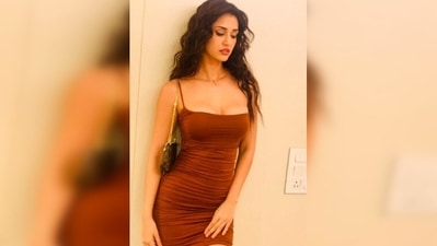 Disha Patani accessorised her look with a small Luis Vuitton shoulder bag and a small gold cross charm rosary necklace. (Instagram/@dishapatani)