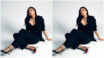 Styled by fashion stylist Chandini Whabi, Athiya wore her long tresses open in wavy curls with a middle part. (Instagram/@chandiniw)