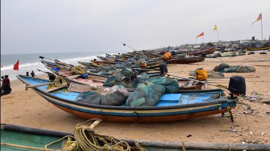 Boats anchored along the sea shore in view of Cyclone Jawad in Puri on Friday. (PTI PHOTO.)