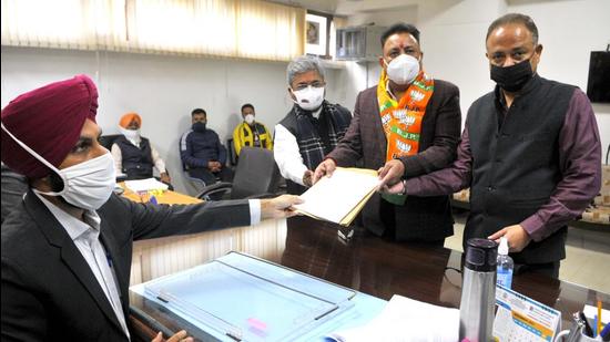 Chandigarh mayor Ravi Kant Sharma filing his nomination papers for the MC election at the SDM office in Sector 42 on Friday. (Keshav Singh/HT)