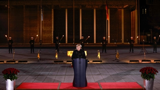 German Chancellor Angela Merkel makes a speech at the Defence Ministry during the Grand Tattoo (Grosser Zapfenstreich), a ceremonial send-off for her in Berlin.(AFP)