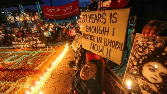 Children born with congenital disabilities, believed to have been caused by the exposure of their parents to gas leakage in the 1984 Bhopal gas tragedy, along with supporters take part in a candlelight vigil to pay homage to those killed in the disaster, in Bhopal.(PTI)