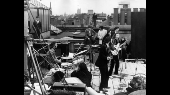 The Beatles at their last live concert, on the rooftop of their Apple Corps headquarters in London, in 1969. You can just make out John Lennon’s then-girlfriend Yoko Ono on the right. (Getty Images) The Beatles at their last live concert, on the rooftop of their Apple Corps headquarters in London, in 1969. You can just make out John Lennon’s then-girlfriend Yoko Ono on the right. (Getty Images)