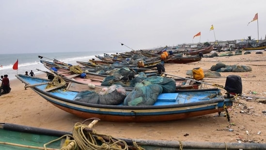 Boats anchored along the sea shore in view of cyclone Jawad in Odisha's Puri on Friday. (PTI PHOTO.)