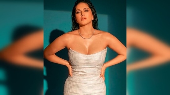 Sunny Leone poses with her hands on her waist and flaunts her curves in this body-hugging dress by Rudraksh Dwivedi.(Instagram/@sunnyleone)