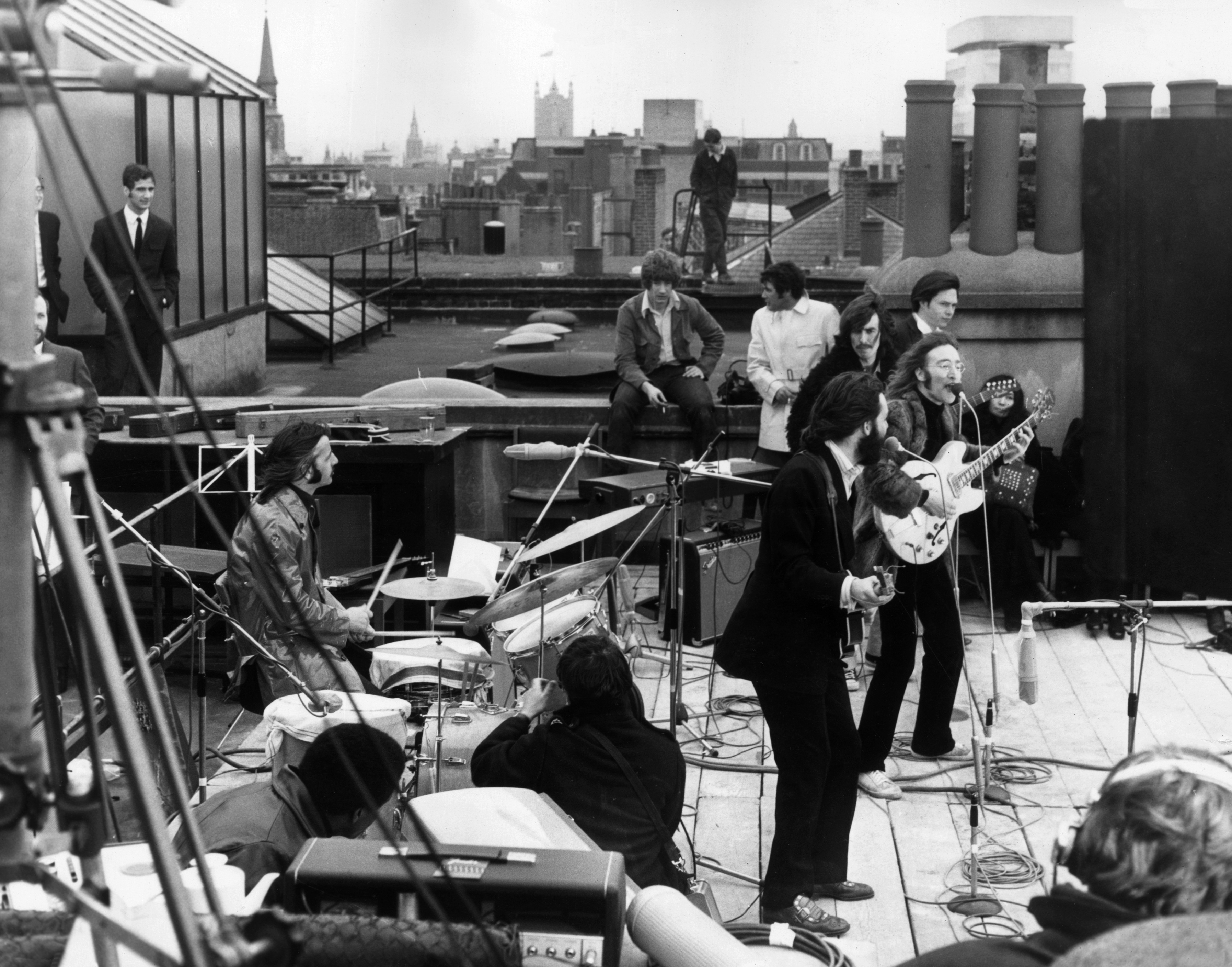 The Beatles at their last live concert, on the rooftop of their Apple Corps headquarters in London, in 1969. You can just make out John Lennon’s then-girlfriend Yoko Ono on the right. (Getty Images) The Beatles at their last live concert, on the rooftop of their Apple Corps headquarters in London, in 1969. You can just make out John Lennon’s then-girlfriend Yoko Ono on the right. (Getty Images)