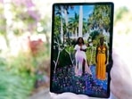 The late Breonna Taylor, left, and her sister Ju'Niyah Palmer, right, are shown on a screen as part of an augmented reality (AR) garden titled The late Breonna Taylor, left, and her sister Ju'Niyah Palmer, right, are shown on a screen as part of an augmented reality (AR) garden titled
