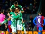 Betis players celebrate at the end of the Spanish La Liga soccer match between Barcelona and Real Betis at the Camp Nou stadium, in Barcelona, Spain, Saturday, Dec. 4, 2021. Betis won 1-0. (AP Photo/Joan Monfort)(AP) Betis players celebrate at the end of the Spanish La Liga soccer match between Barcelona and Real Betis at the Camp Nou stadium, in Barcelona, Spain, Saturday, Dec. 4, 2021. Betis won 1-0. (AP Photo/Joan Monfort)(AP)