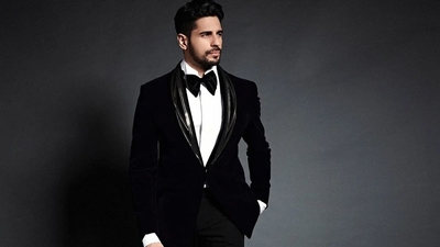 The handsome hunk teamed the jacket with a white crisp collar shirt, a black velvet bow tie, a pair of black straight trousers and finished with a pair of black shoes. The ensemble is credited to Indian fashion designer Gaurav Gupta’s eponymous label and originally costs  <span class='webrupee'>₹</span>1,05,000 on the designer website. (Instagram/sidmalhotra)