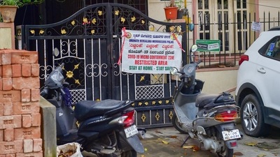 A poster at the residence of the 46-year-old doctor who was detected with the Omicron variant of Covid-19, in Bengaluru, says it is a restricted area. (PTI) A poster at the residence of the 46-year-old doctor who was detected with the Omicron variant of Covid-19, in Bengaluru, says it is a restricted area. (PTI)