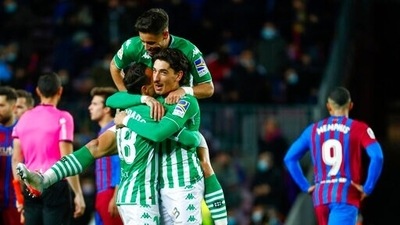 Betis players celebrate at the end of the Spanish La Liga soccer match between Barcelona and Real Betis at the Camp Nou stadium, in Barcelona, Spain, Saturday, Dec. 4, 2021. Betis won 1-0. (AP Photo/Joan Monfort) (AP) Betis players celebrate at the end of the Spanish La Liga soccer match between Barcelona and Real Betis at the Camp Nou stadium, in Barcelona, Spain, Saturday, Dec. 4, 2021. Betis won 1-0. (AP Photo/Joan Monfort) (AP)