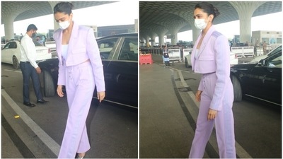 Deepika wore a lavender pantsuit for the jet-set look. It features co-ord pieces, a crop top and minimal accessories. It is effortless and chic, all at the same time. (HT Phtoto/Varinder Chawla)