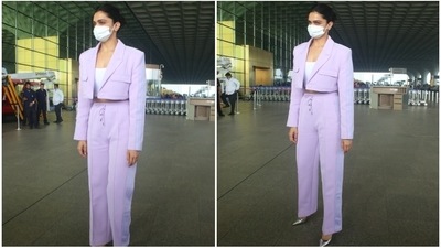 Deepika accessorised her ensemble minimal accessories. She just chose a pair of metallic silver pointed pumps and nothing else, allowing the outfit to be the centre of attention. A sleek bun, minimal make-up, and white face mask for protection against Covid-19 rounded off her look. What do you think? (HT Phtoto/Varinder Chawla)