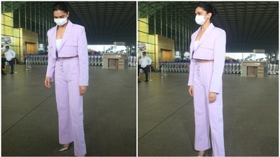 Deepika picked a lavender coloured blazer featuring a notch lapel collar, full sleeves adorned with metallic stripes, front patch pockets, puffed shoulders, single button fastening left open, and a cropped length. She wore it over a bodycon crop top that hinted at the diva's toned midriff. (HT Phtoto/Varinder Chawla)