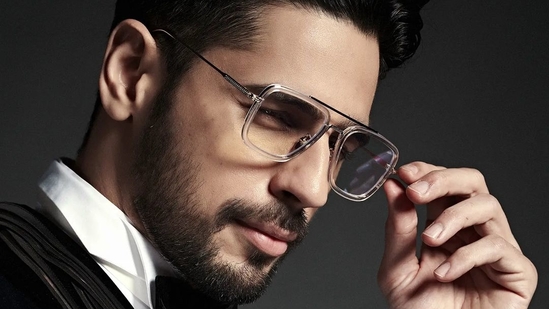 He accessorised it with a black finger ring and a pair of transparent-rimmed reading glasses while sporting a light stubble and sleek pushed back hair.(Instagram/sidmalhotra)
