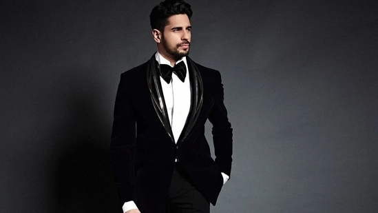 The handsome hunk teamed the jacket with a white crisp collar shirt, a black velvet bow tie, a pair of black straight trousers and finished with a pair of black shoes. The ensemble is credited to Indian fashion designer Gaurav Gupta’s eponymous label and originally costs <span class=