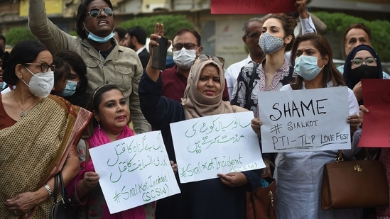 Members of Joint Action Committee carry placards during a protest in Karachi against the killing of a Sri Lankan factory manager in Sialkot after he was beaten to death and set ablaze by a mob who accused him of blasphemy, officials said.(AFP) Members of Joint Action Committee carry placards during a protest in Karachi against the killing of a Sri Lankan factory manager in Sialkot after he was beaten to death and set ablaze by a mob who accused him of blasphemy, officials said.(AFP)