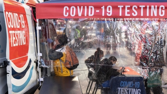 A person takes the Covid-19 test in Times Square on Friday.(AP)