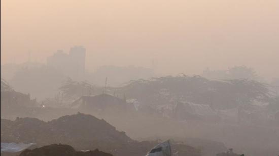 Low visibility due to a thick layer of smog, during the winter season in Gurugram, on Saturday. (PTI) Low visibility due to a thick layer of smog, during the winter season in Gurugram, on Saturday. (PTI)