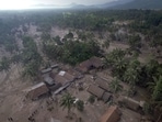 An aerial view shows houses covered in volcanic ash after the eruption of Mount Semeru hit Sumber Wuluh Village, Lumajang, East Java province, Indonesia An aerial view shows houses covered in volcanic ash after the eruption of Mount Semeru hit Sumber Wuluh Village, Lumajang, East Java province, Indonesia 